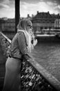 Woman waiting in the bridge of arts in paris Royalty Free Stock Photo