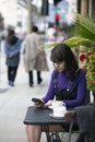 Woman Waiting for a Friend at a Local Sidewalk Cafe Royalty Free Stock Photo