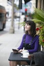 Woman Waiting for a Friend at a Local Sidewalk Cafe Royalty Free Stock Photo