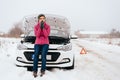Woman waiting for help or assistance - winter car breakdown Royalty Free Stock Photo