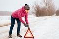 Woman waiting for help or assistance - winter car breakdown Royalty Free Stock Photo
