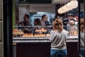 Woman waiting for her food order at pintxos restaurant Royalty Free Stock Photo