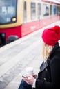 Woman waiting for suburban train in station Royalty Free Stock Photo