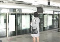 Woman waiting for train at the platform of a subway station Royalty Free Stock Photo