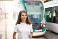 Woman waiting tram on light rail station Royalty Free Stock Photo