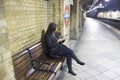 Woman waiting underground in London