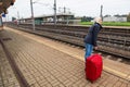 Woman waits for her train station Royalty Free Stock Photo