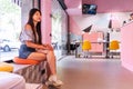 woman waits her turn sitting in the beauty salon