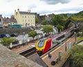 A Woman Waits for a Train in Conwy