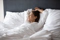 Woman wake up lying in bed dreaming enjoy new day Royalty Free Stock Photo