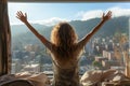 Woman waking up in bed with stretched hand up on a window sill. Cityscape