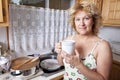 Woman waking up with a coffee