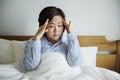 A woman waking up with headache Royalty Free Stock Photo