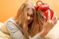 Woman waking up late turning off alarm clock. Royalty Free Stock Photo