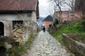 Woman walk down a historical street