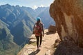 Woman walk on narrow mountain path Royalty Free Stock Photo