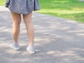 Woman walk solely under tree shade Royalty Free Stock Photo