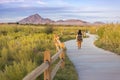 A woman walkimg on the trail in Wetlands park Las Vegas