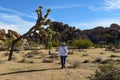 Woman walking alone on desert trail