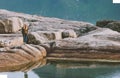 Woman walking alone enjoying seaside rocks view outdoor