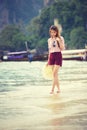 Woman walking along the beach