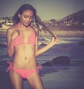 Woman walking along beach in bikini Royalty Free Stock Photo