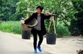 Pengzhou, China: Woman Carrying Water Buckets Royalty Free Stock Photo