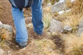 Woman walking along a mountain footpath Royalty Free Stock Photo