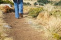 Woman walking along a mountain footpath Royalty Free Stock Photo