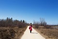 Woman walking along a nature trail Royalty Free Stock Photo