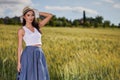 Woman is walking along the road among the fields Royalty Free Stock Photo