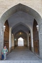 Woman walking through the archway of the domed bazaar in Bukhara, Uzbekistan.