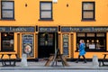 Woman walking by Aunty Lena's, popular bar and lounge,Village Of Adare,Ireland,October,2014