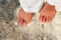 Woman walking barefoot on the beach Royalty Free Stock Photo