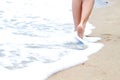 Woman walking on the beach Royalty Free Stock Photo