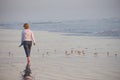 Woman Walking on Beach