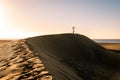 Woman walking at the beach of Maspalomas Gran Canaria Spain, girl at the sand dunes desert of Maspalomas Royalty Free Stock Photo