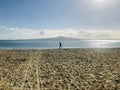 A woman walking on the beach at mission bay. Royalty Free Stock Photo