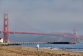 Woman walking on beach near Golden Gate Bridge Royalty Free Stock Photo