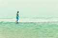 Woman walking beach tidal pool ocean