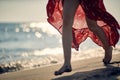 Woman walking on the beach at sunrise and enjoying her leisure Royalty Free Stock Photo