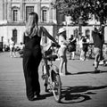 Woman walking with bike in the bridge of arts in paris Royalty Free Stock Photo