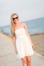 Woman walking on the breakwater Royalty Free Stock Photo