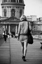 Woman walking in the bridge of arts in paris Royalty Free Stock Photo