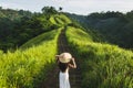 Woman walking on Campuhan Ridge way Bali, Ubud in morning