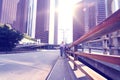 Woman walking at city road by skyscraper buildings and Sky View, financial district.