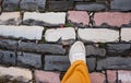 Woman walking on cobblestone street. Walking on the paving road of an old city in Europe Royalty Free Stock Photo