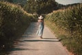 Woman walking among country fields