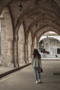 Woman is walking in courtyard of ancient St.Lazarus church in Larnaca Royalty Free Stock Photo