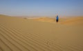 Woman walking in a desert